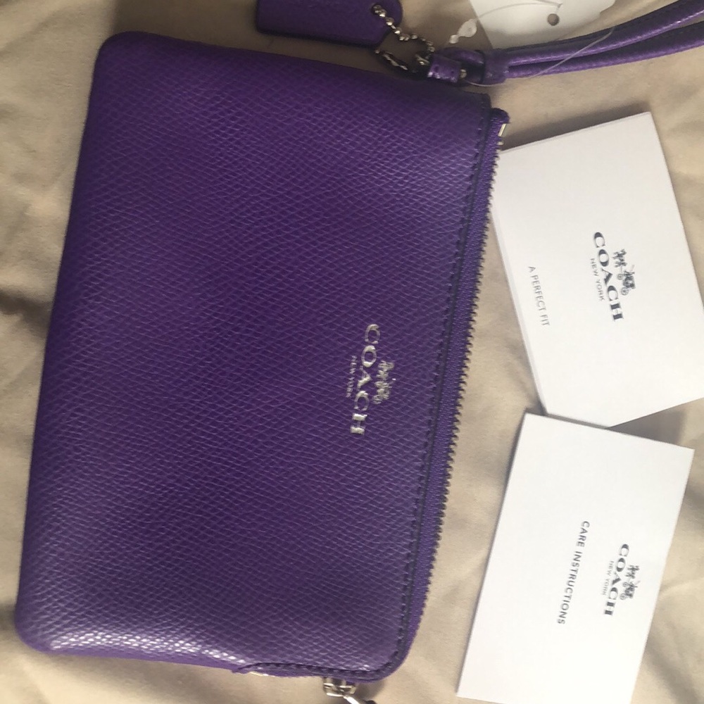 Small coach wristlet. Tags attached never used